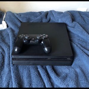 PlayStation 4 slim w/ controller, cords, and games